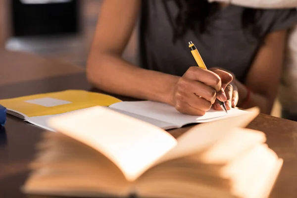 depositphotos_153333874-stock-photo-woman-writing-in-notebook.jpg